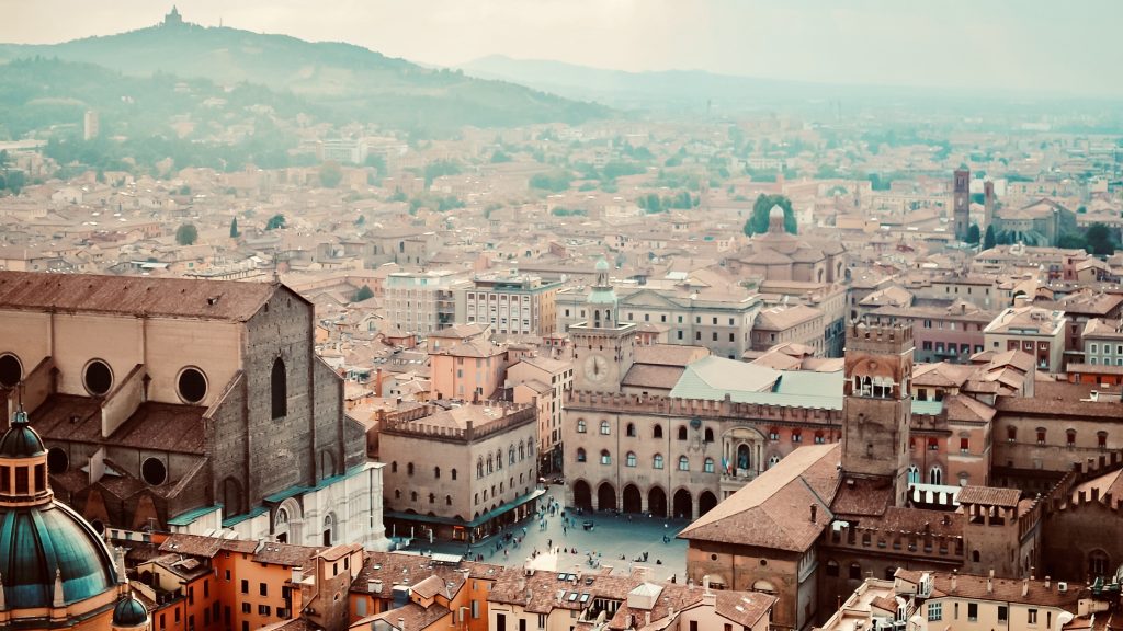 Aerial panoramic cityscape of Bologna, Italy. Rooftops of typical houses, ancient buildings and medieval towers